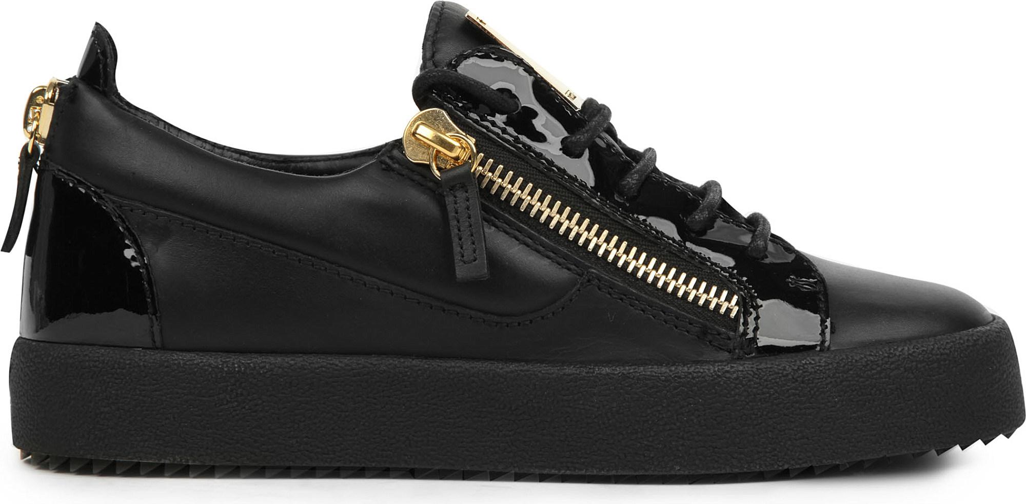 black trainers with gold zip